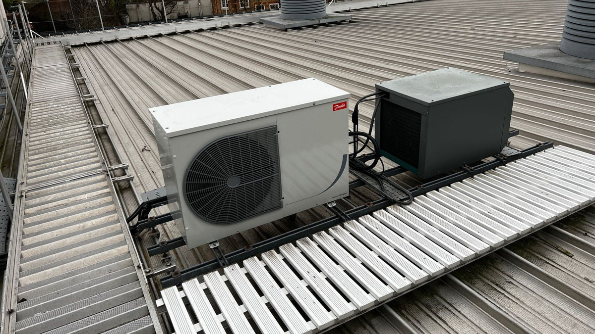 Refrigeration condensing unit on a school roof, from a Climate Flow condenser replacement